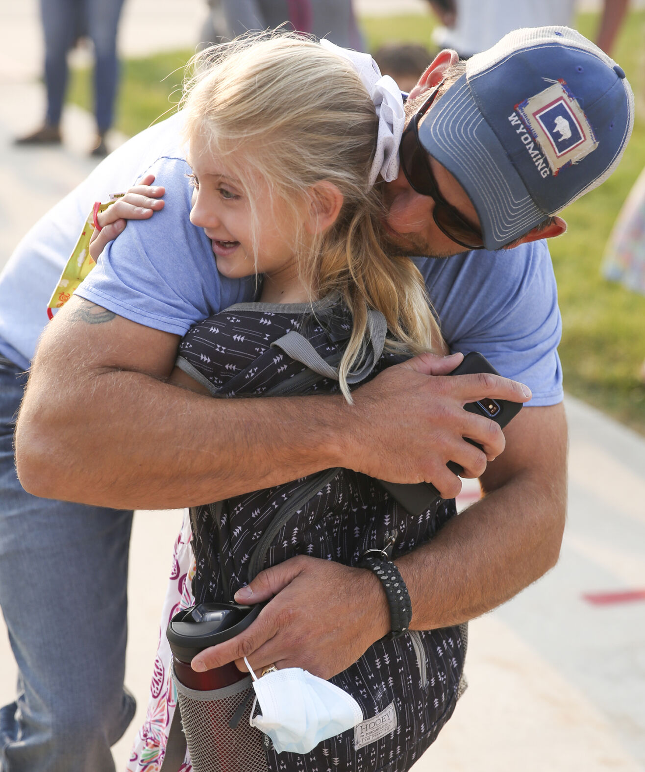 Zach Byram hugs his daughter Shaye as he drops her off